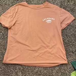 This shirt has some paint stains on it. I only wore this about 4 times.